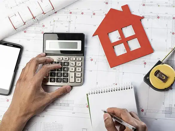 Property tax calculations on blueprints, representing the importance of accurate property tax assessments and the need for professional protest services in Fort Bend County.